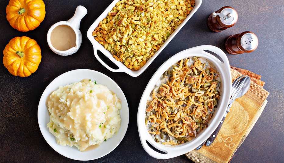 All traditional Thanksgiving side dishes, mashed potatoes, green beans and stuffing