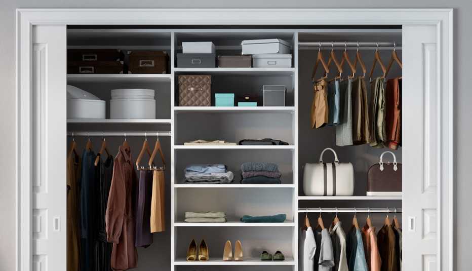 example of an organized closet with multi level hangar bars and shelves