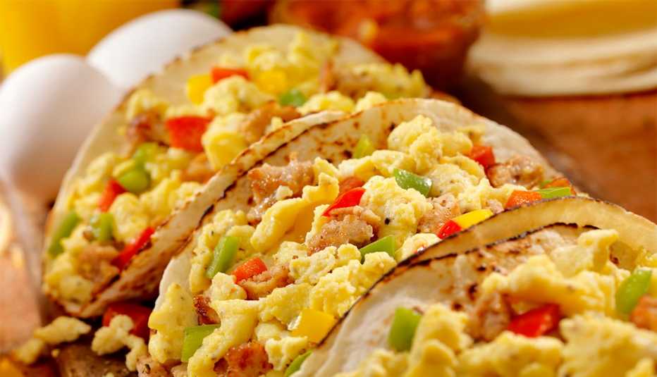 Breakfast Taco with scrambled eggs, sausage, peppers and cheddar cheese 