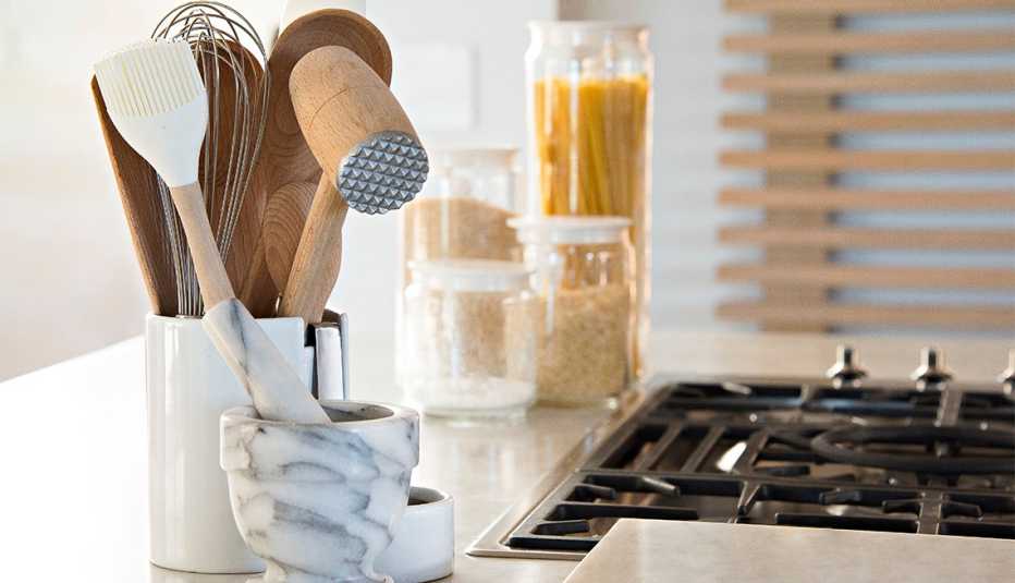 kitchen utensils next to a stove