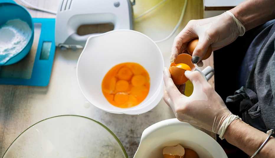A man mixing raw eggs