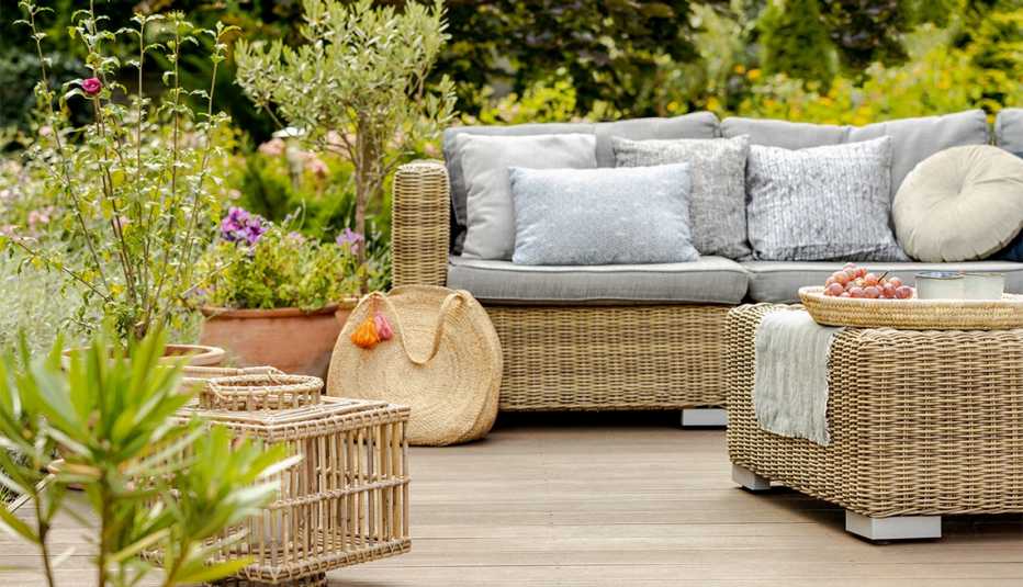 Modern designed terrace with wicker furniture and plants