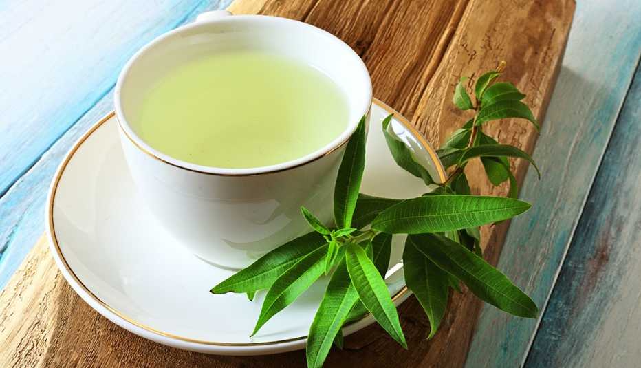 Lemon verbena leaves and white tea cup