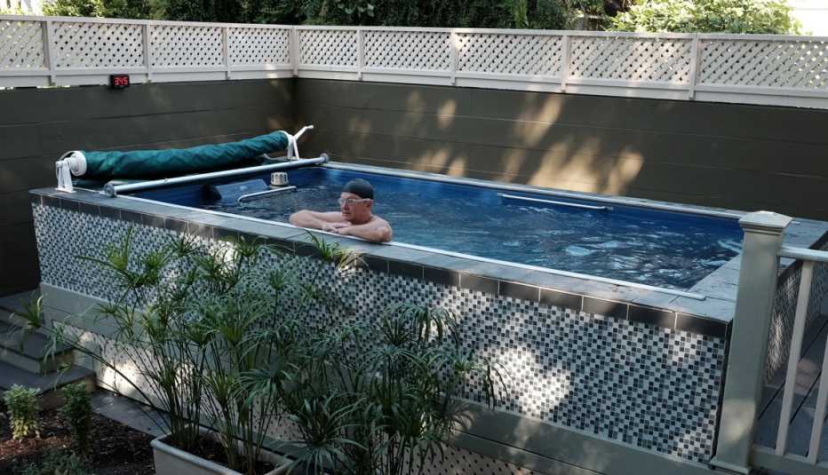 an above ground pool with a man in it