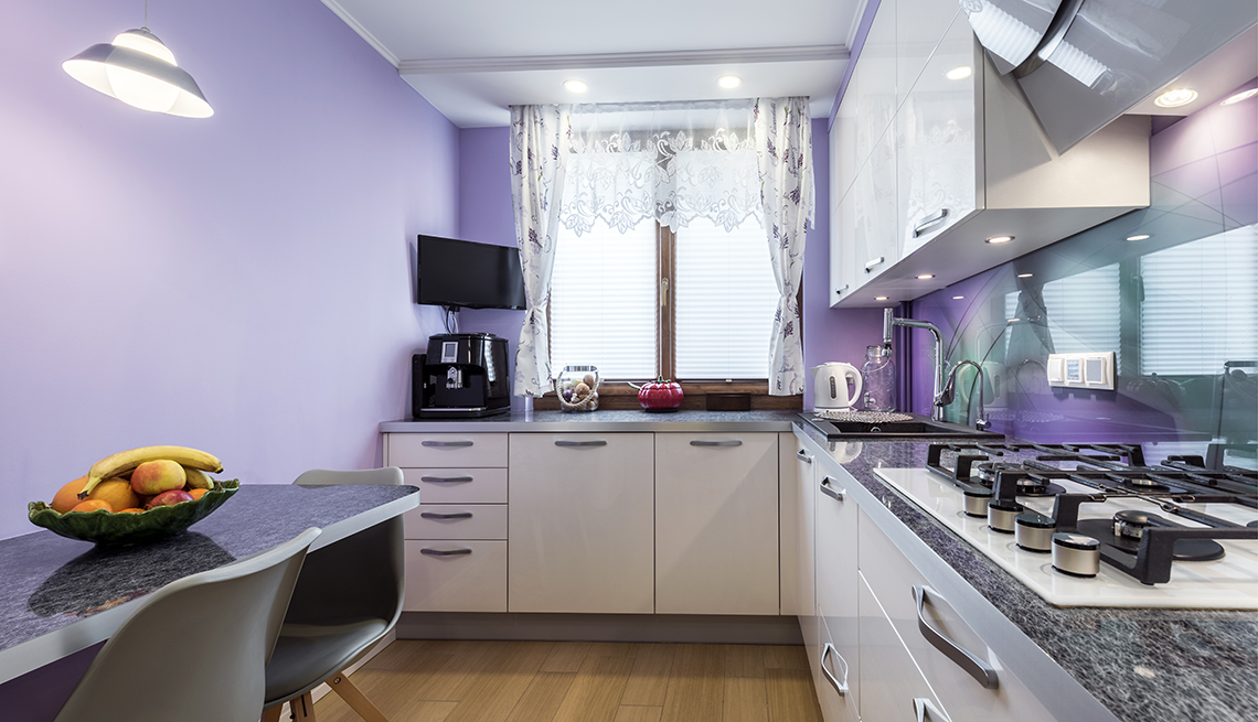 a kitchen with walls painted in a purple color called very peri pantones color of the year for twenty twenty two