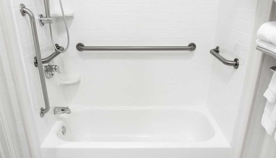 Handicapped disabled access bathroom bathtub with grab bars.