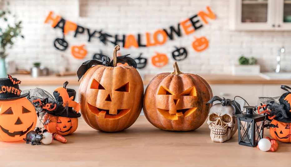 Jack O' Lanterns and other Halloween decor on a table