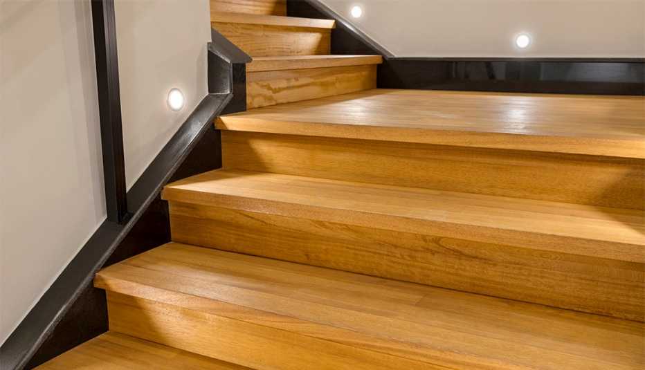 wood stairs with lights illuminating