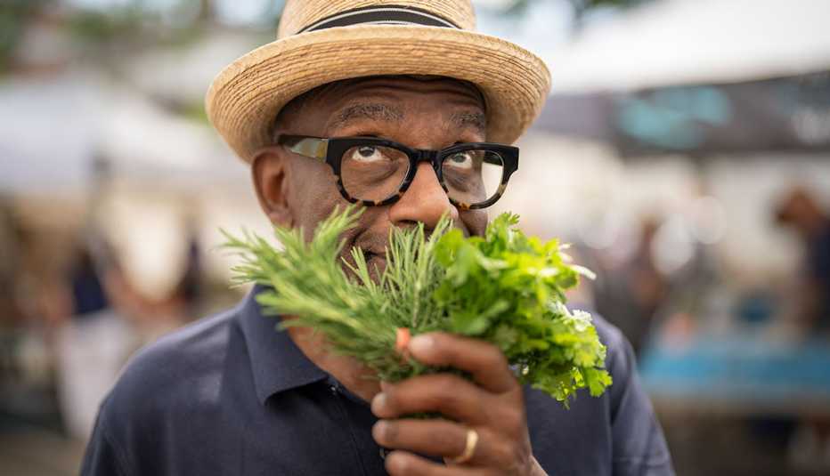 al roker the cohost of the today show smelling fresh herbs