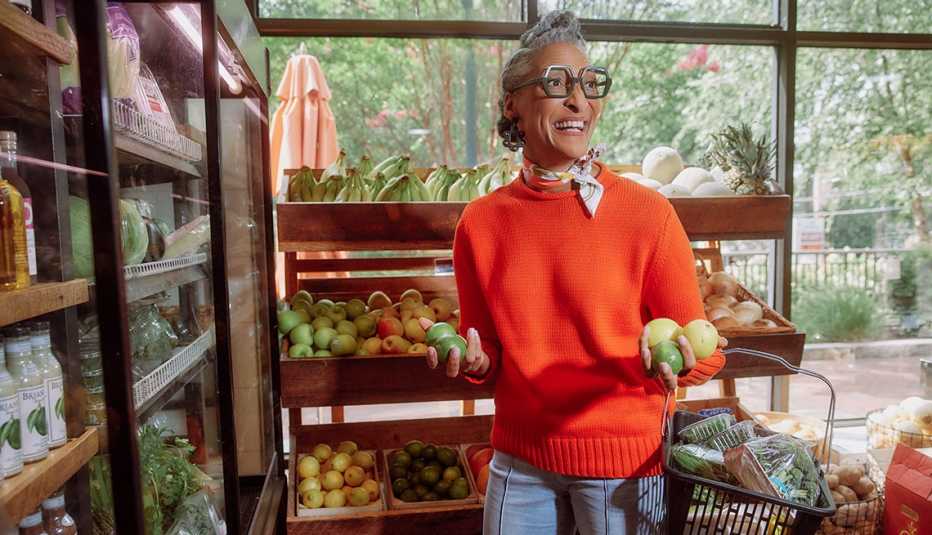 chef and t v host carla hall shopping for fresh fruit