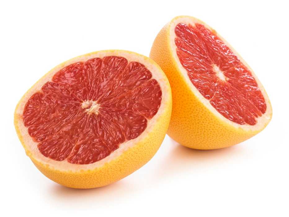 Grapefruit halved, against a white background
