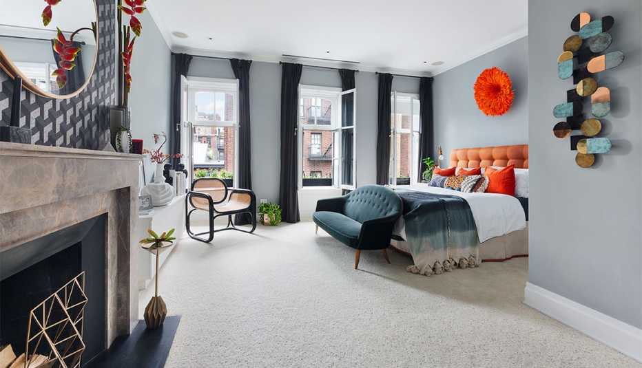 a staged home at two zero eight west eleventh street showing a master bedroom