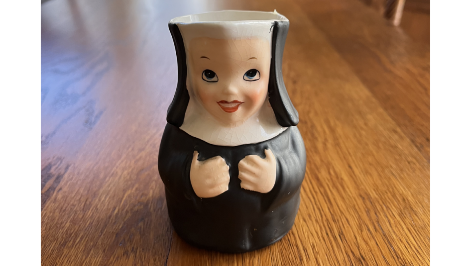 a creamer jar in the shape of a nun