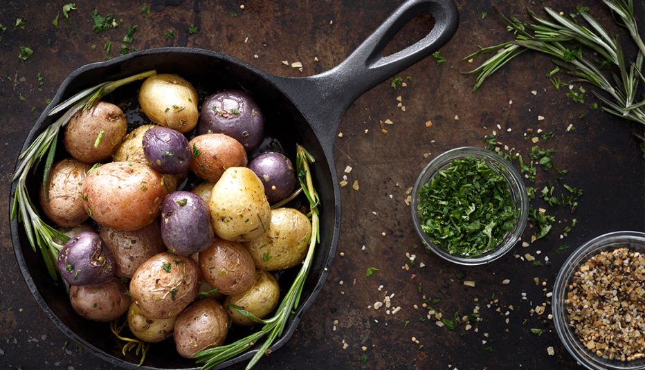 a pan of new potatoes with rosemary