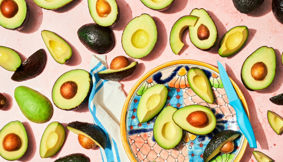 a table covered in sliced ripe avocados