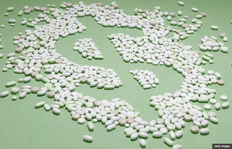 Conceptual Pills in the shape of a dollar sign