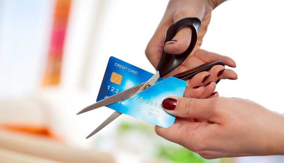 cutting credit card, scissors, Financial Freedom: Five Tips for Retirement Savings
