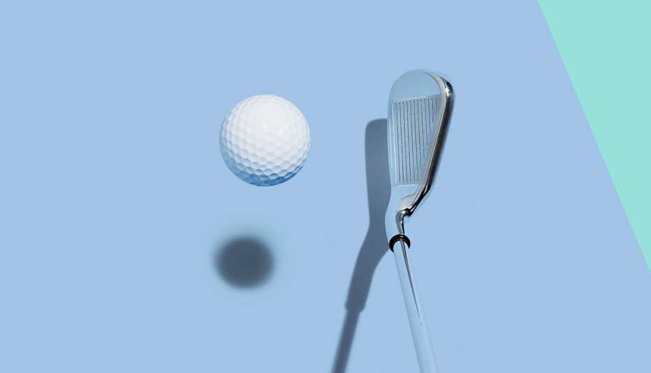 golf club and golf ball on blue background