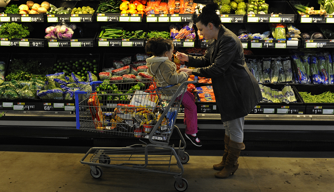 A woman and child at a grocery store