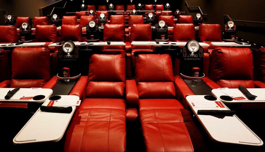 Reclining theater seats with pivoting dining trays are among the amenities in AMC's Dine-In Theatre at Block 37 in downtown Chicago. 