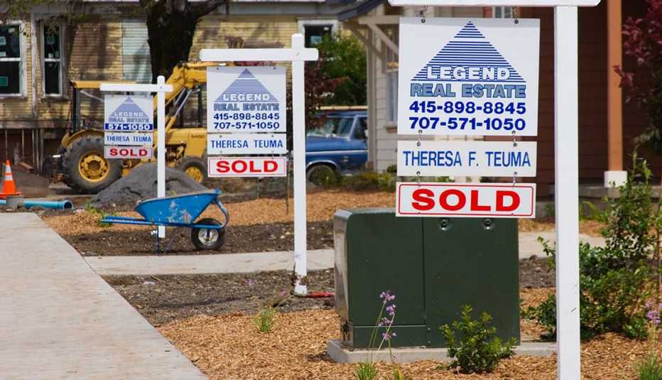 Real Estate signs indicate newly built homes that were sold before construction was completed in Santa Rosa California