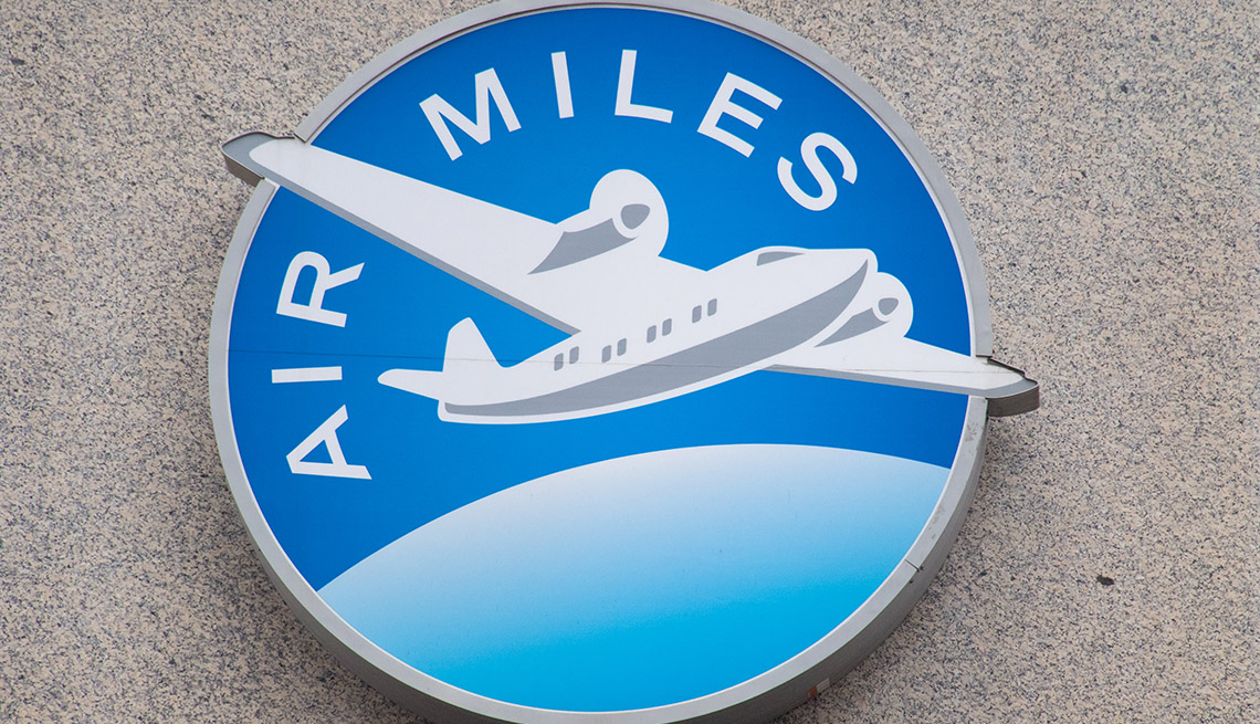 logo for an air miles rewards program displayed on a wall