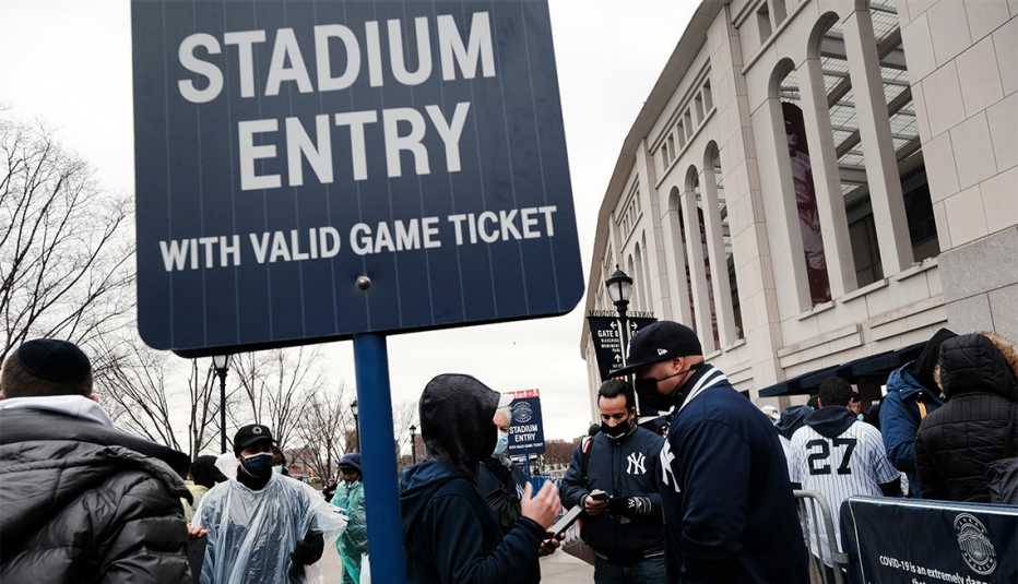 People line up to enter Yankee Stadium in the Bronx for the Opening Day of baseball season on April 01, 2021 in New York City.