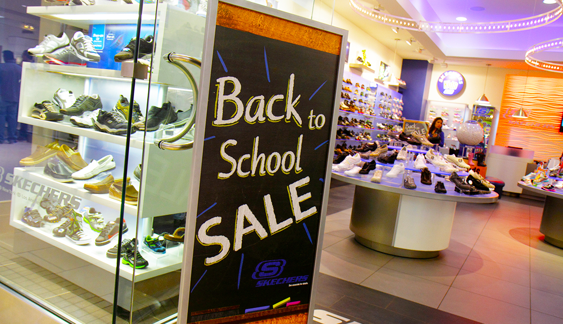 back to school sale sign in a shoe store window