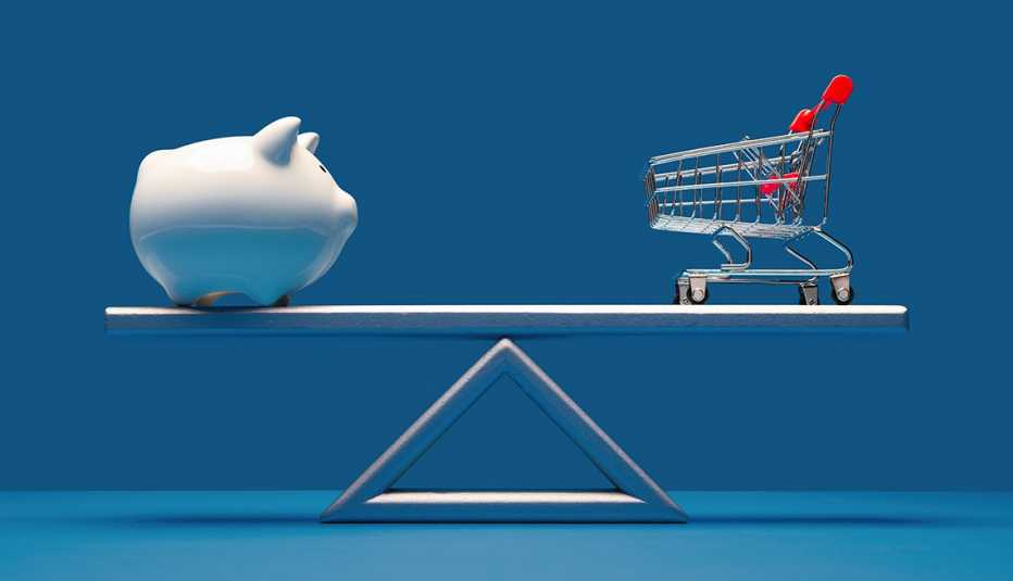 piggy bank on balance scale with shopping cart