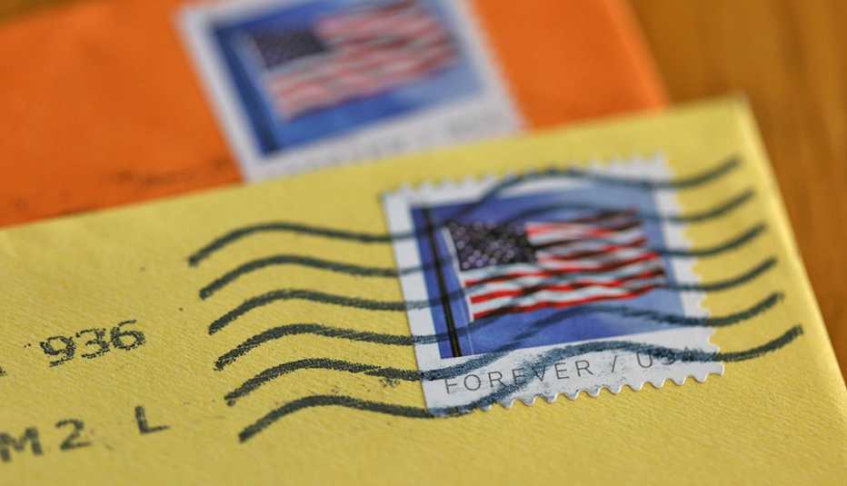 U.S. Postal Service (USPS) forever stamps are seen on envelopes