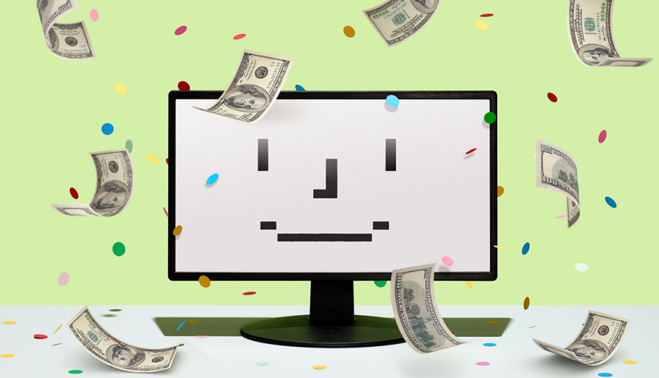 computer monitor on a green field with money floating around it