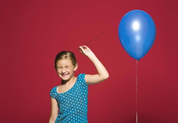 A girl ready to burst a balloon, Balloon loans are bad to co-sign