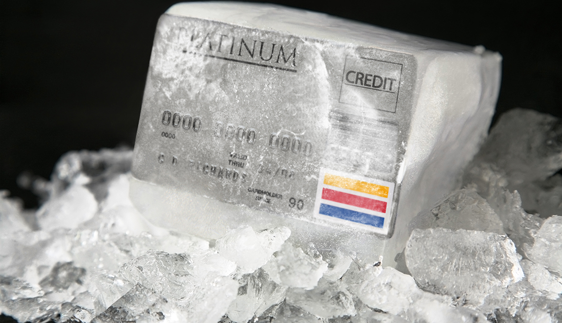 credit card frozen in a block of ice