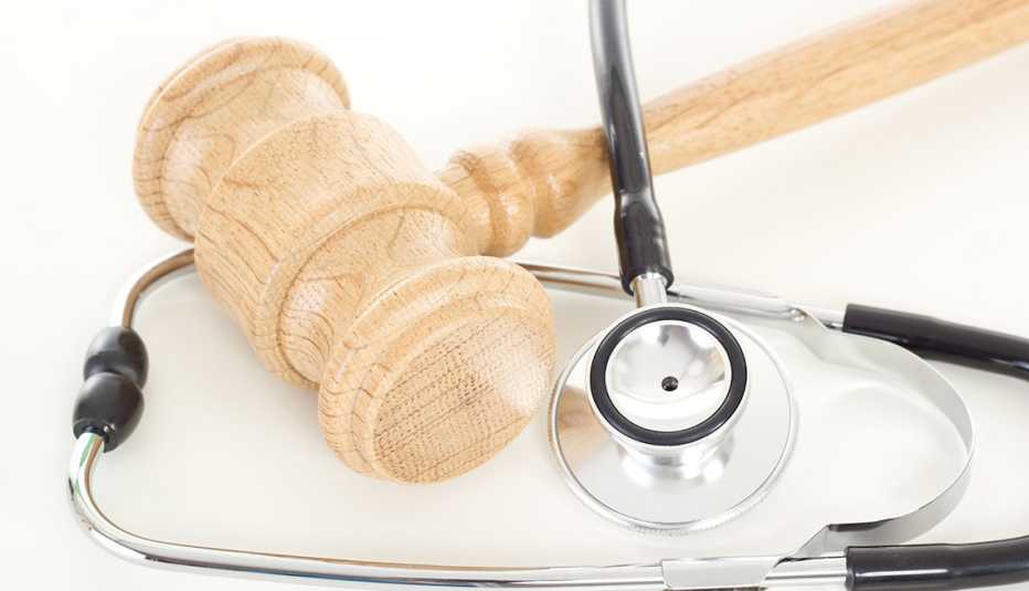 A wooden gavel with a stethoscope