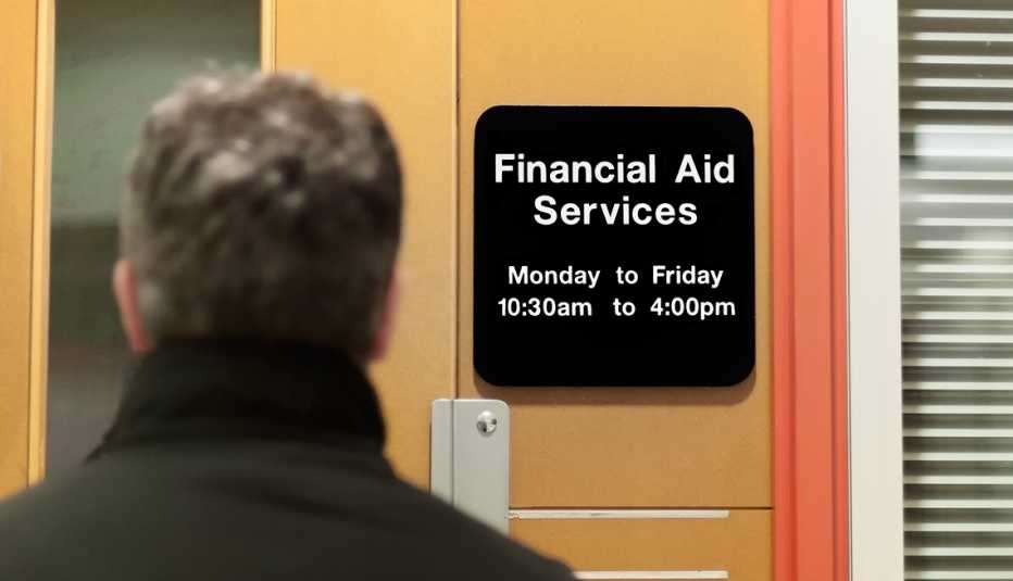 older student entering a college financial aid services office