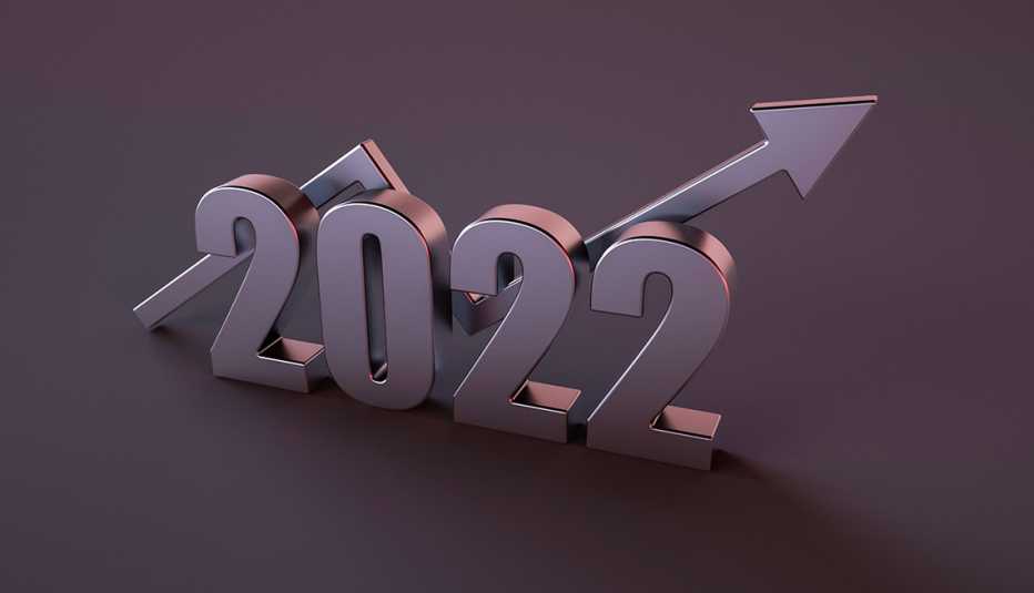 the year 2022 in numbers sits over a upward trendin arrow denoting rising interest rates