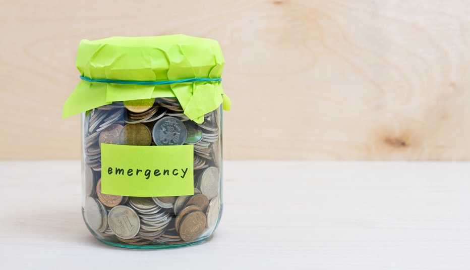 Change jar with emergency fund written on it 