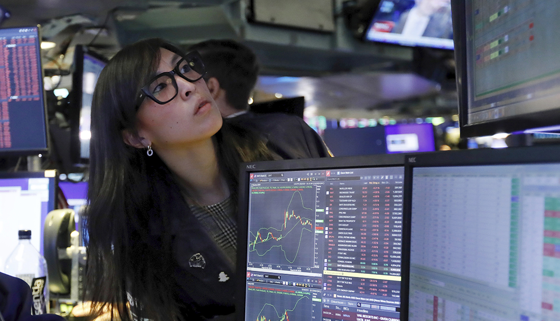 Specialist Erica Fredrickson with worried look as she watches prices fall, on the floor of the New York Stock Exchange, Monday, March 9, 2020. 