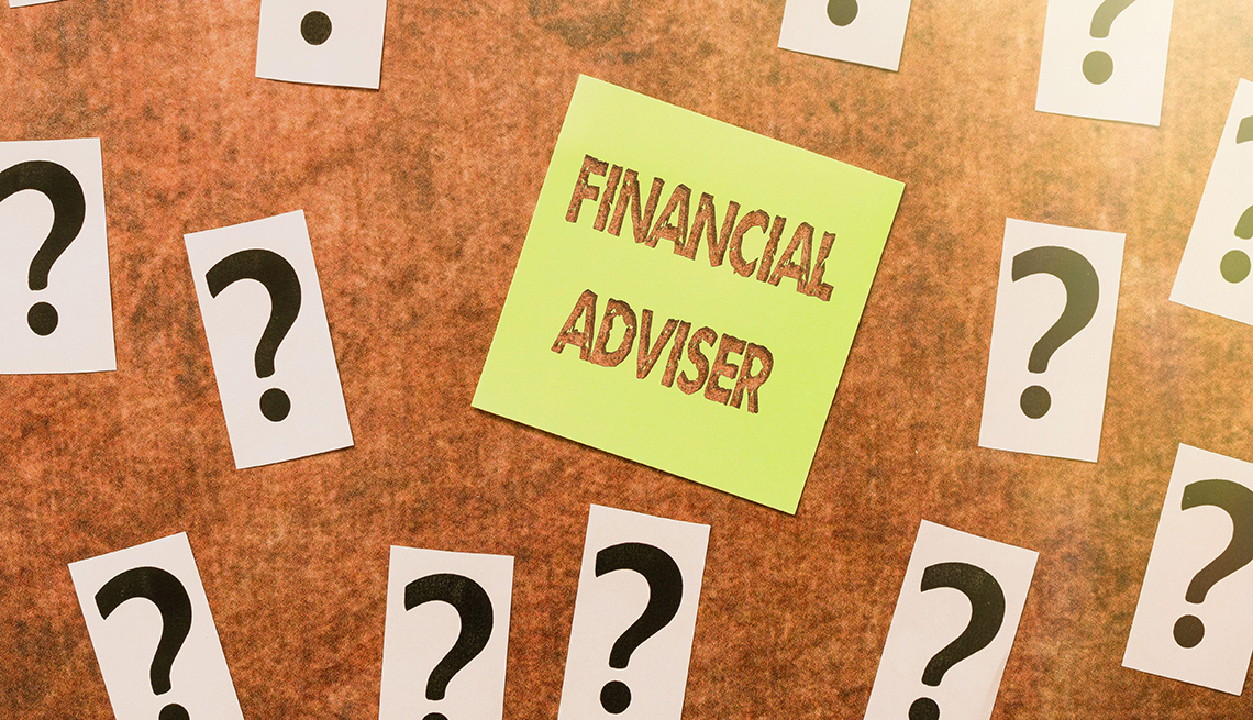 post it note with the words financial adviser surrounded by question marks