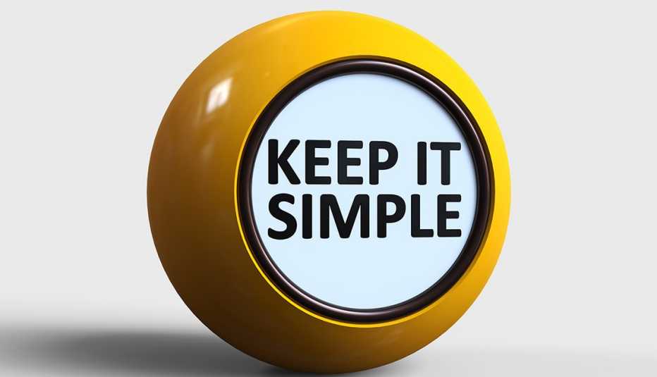 shiny yellow ball with the message Keep It Simple in black font on white facing