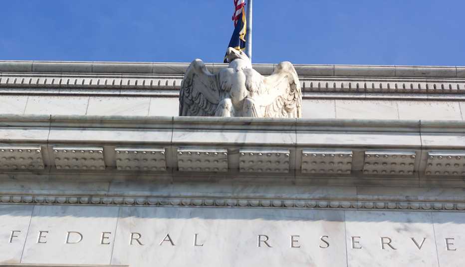 The Federal Reserve building in Washington, D.C., looking up at the eagle statue on top.
