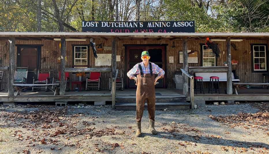 tim conway in waders standing in front of the lost dutchman mining association