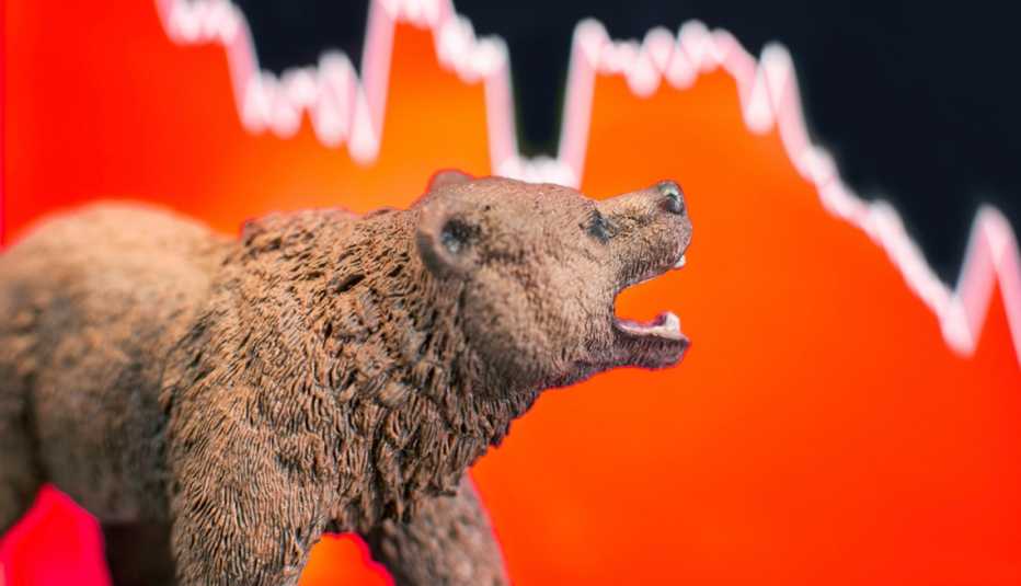 bear in front of stock market graph
