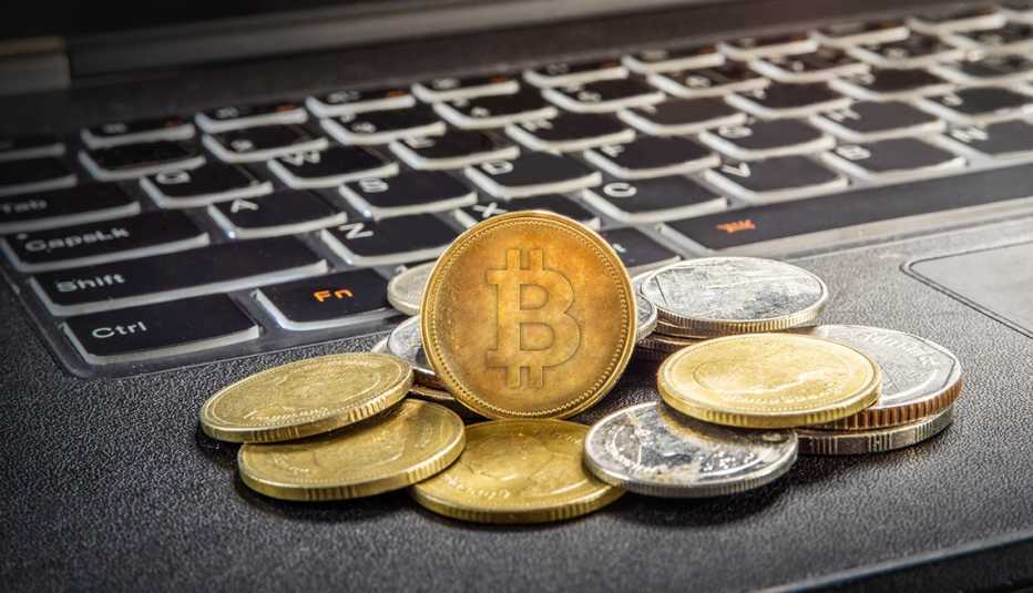 Cryptocurrency concept with bitcoins on a laptop