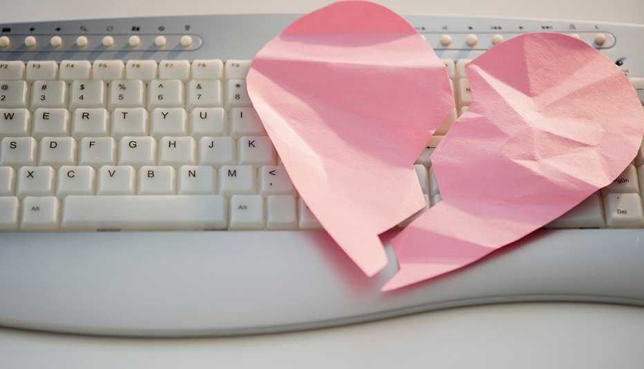lose up of broken heart on computer keyboard