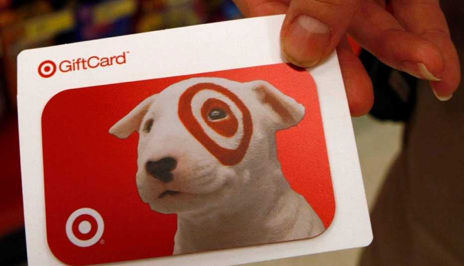 A Target gift card is displayed in a Target store
