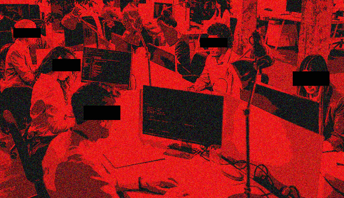 anonymous people working at a large call center