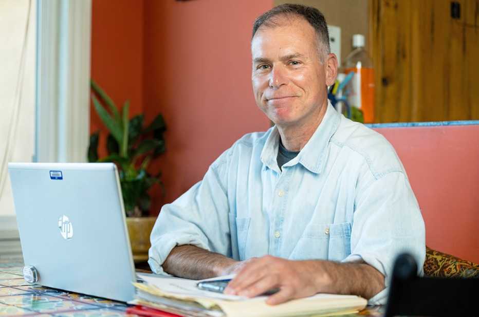David Brown, of AARP’s volunteer Fraud Watch team, photographed at home in Sherman Oaks, California April 6, 2023.