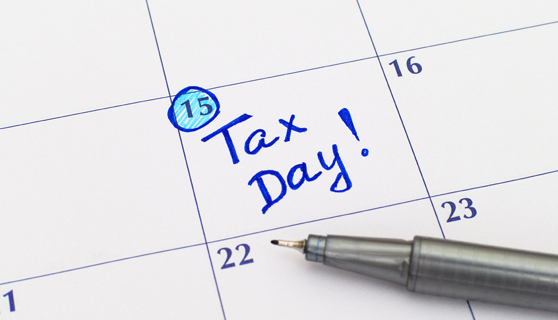 Reminder Tax day in calendar with blue pen