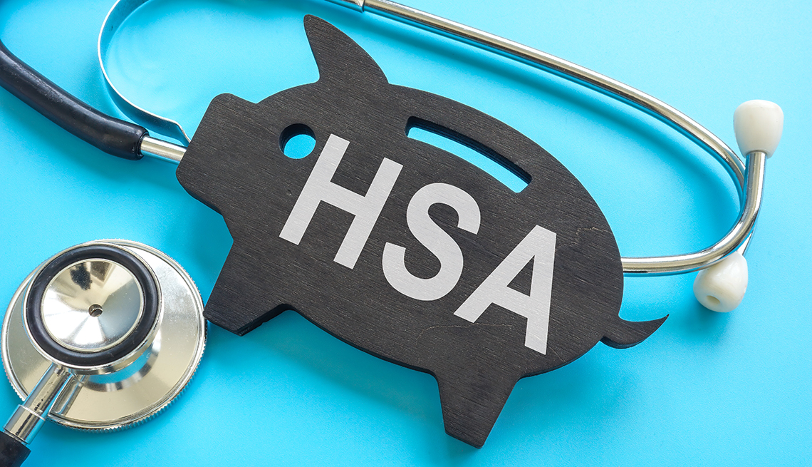 HSA health savings account. Stethoscope and piggy bank.